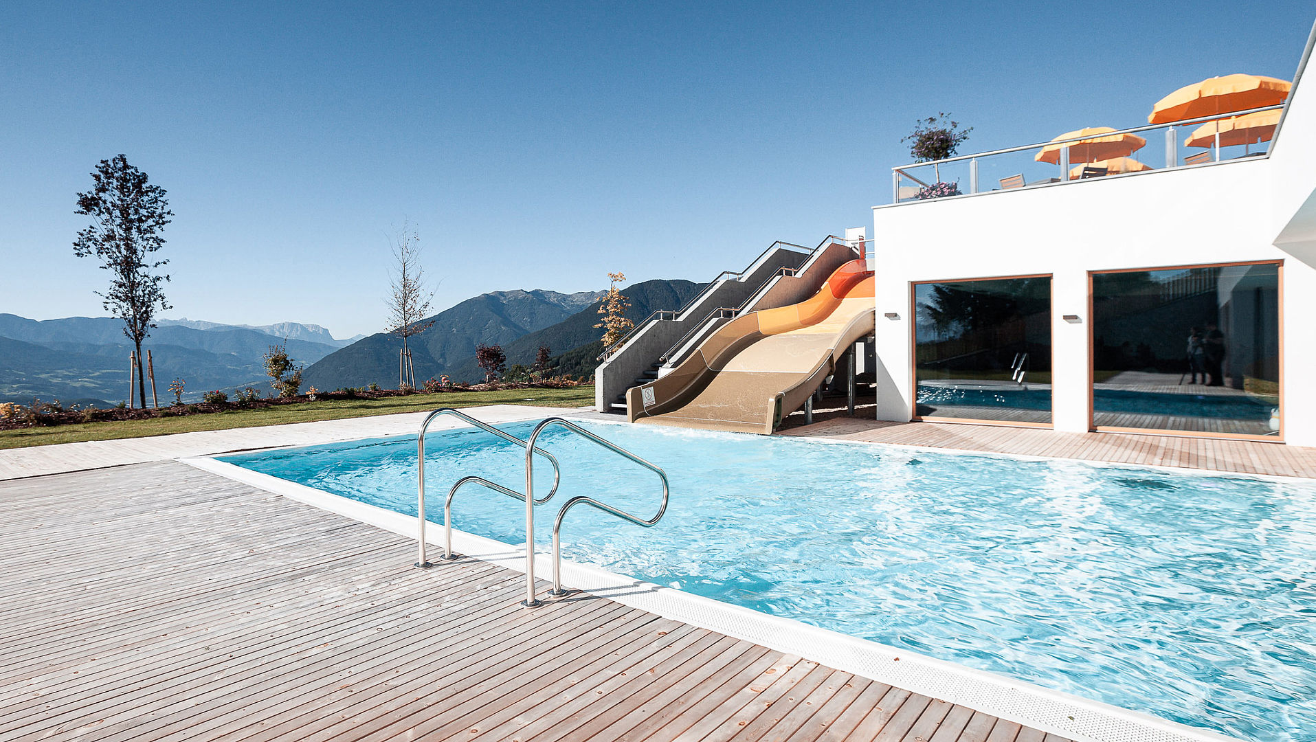 Outdoor swimming pool with wide slide