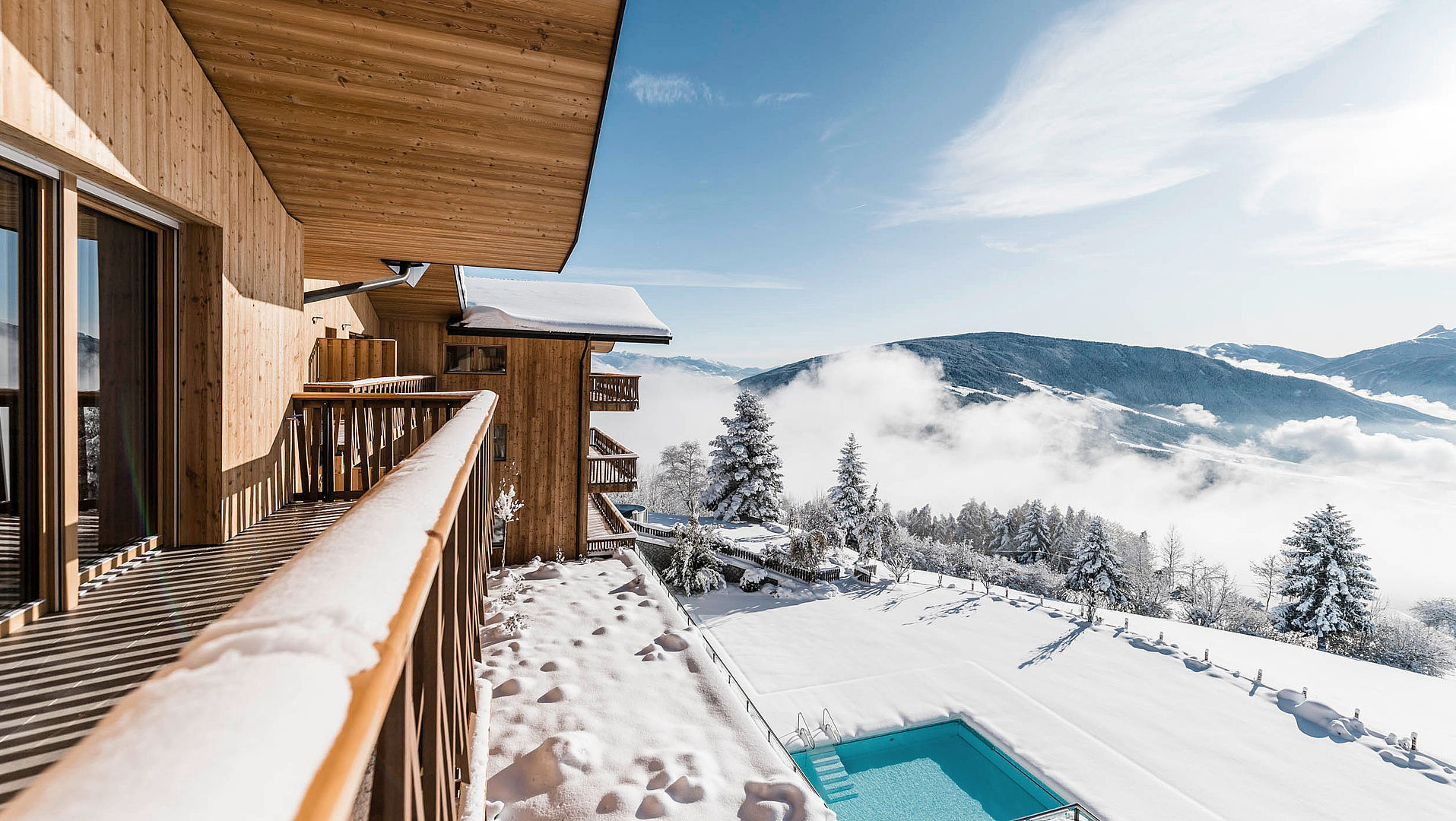 Balcony with view of swimming pool in the snow