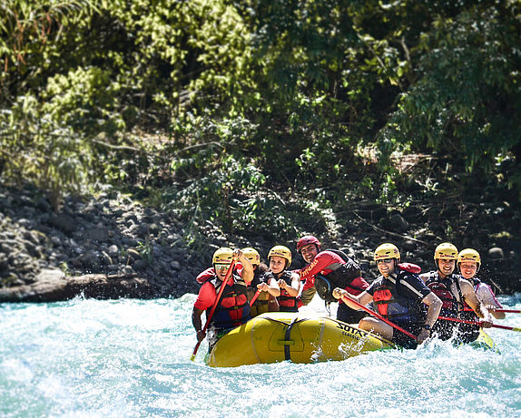 A group of people go rafting