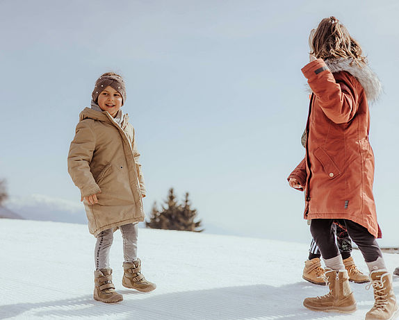 Children talking in the snow