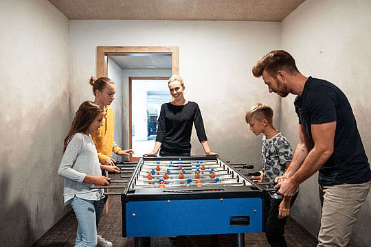 Family plays table football together